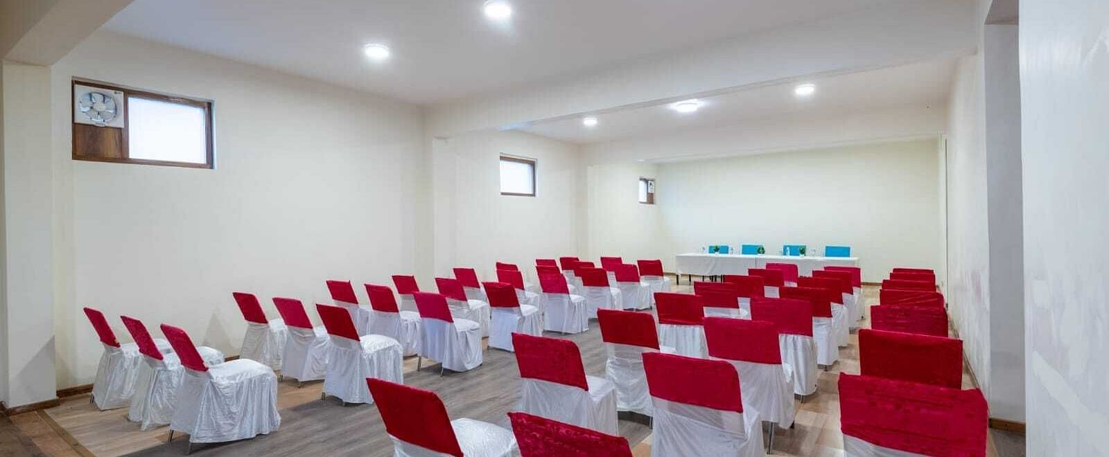 A large conference room with rows of chairs set up for a meeting or presentation  | DLS Serenity Resort and Spa